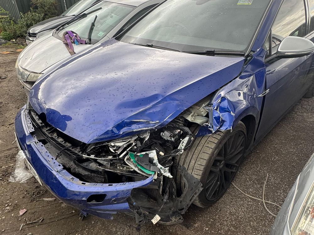 Same BMW M4 before repair, with smashed front bumper, wing and headlight